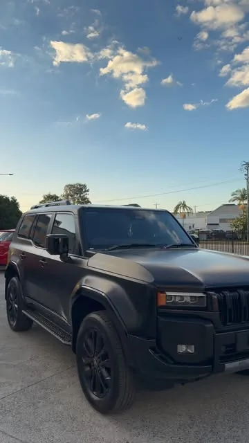 Toyota LandCruiser 300 Series in a satin black wrap with blacked-out trim