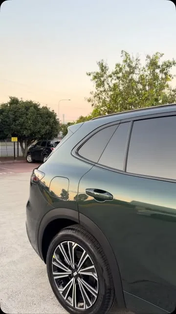Dark green SUV with tinted windows