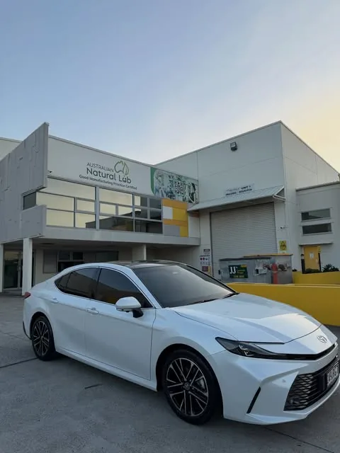 White Toyota Camry with fresh window tint outside the Archerfield studio
